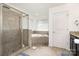 Bathroom with granite counters, dual sinks, walk-in shower and a large tub at 2577 Shoal Park Rd, Concord, NC 28027