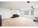 Large bonus room with carpet flooring, a media projector, multiple speakers, a sofa and bright natural light at 2577 Shoal Park Rd, Concord, NC 28027