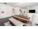 Bright dining area features a modern table and bench with upholstered chairs, with easy access to entry and living area at 2577 Shoal Park Rd, Concord, NC 28027