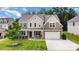 Charming two-story home with covered front porch, manicured lawn and attached two-car garage at 2577 Shoal Park Rd, Concord, NC 28027
