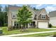 Charming two-story home with a well-manicured lawn and inviting front porch at 2577 Shoal Park Rd, Concord, NC 28027