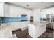 Modern kitchen with white cabinetry, stainless steel appliances, granite countertops, and blue tile backsplash at 2577 Shoal Park Rd, Concord, NC 28027