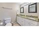Bright bathroom with granite countertops, dual sinks, and modern fixtures at 3020 Stancill Pl, Charlotte, NC 28205