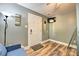 Bedroom featuring a futon, TV, and entry door at 3020 Stancill Pl, Charlotte, NC 28205