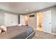 Neutral bedroom featuring carpet, double closets, and an open door to the attached bathroom at 3020 Stancill Pl, Charlotte, NC 28205