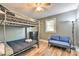 Bedroom featuring bunkbeds, a futon, and a ceiling fan at 3020 Stancill Pl, Charlotte, NC 28205