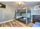 Bedroom featuring bunkbeds, ceiling fan, and modern decor at 3020 Stancill Pl, Charlotte, NC 28205
