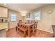 Bright dining area featuring hardwood floors and an adjacent door to outside at 3020 Stancill Pl, Charlotte, NC 28205