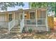 Inviting single-story home featuring a quaint front porch with stylish shutters and an entryway at 3020 Stancill Pl, Charlotte, NC 28205