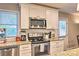 Bright kitchen features granite countertops, stainless steel appliances, white cabinets and subway tile backsplash at 3020 Stancill Pl, Charlotte, NC 28205