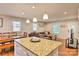 Open floor plan featuring kitchen island open to living and dining areas at 3020 Stancill Pl, Charlotte, NC 28205