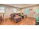 Cozy living room featuring hardwood floors, recessed lighting, and comfortable seating area at 3020 Stancill Pl, Charlotte, NC 28205