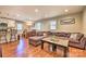 Open-concept living space with hardwood floors, seamlessly connecting the kitchen and dining areas at 3020 Stancill Pl, Charlotte, NC 28205