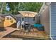 A cozy wooden patio with outdoor dining set and seating, perfect for relaxing and entertaining at 3020 Stancill Pl, Charlotte, NC 28205