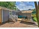 View of the backyard patio with an outdoor dining set, BBQ grill, and comfortable seating area at 3020 Stancill Pl, Charlotte, NC 28205
