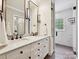 Elegant bathroom featuring a double sink vanity with marble countertop and a glass enclosed shower at 327 Whitestone Rd, Charlotte, NC 28270