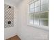 Modern bathroom shower featuring patterned tile wall accents, shower head and frosted window at 327 Whitestone Rd, Charlotte, NC 28270