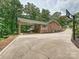 A two car carport that also connects to an outdoor porch at 327 Whitestone Rd, Charlotte, NC 28270