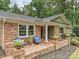 Inviting brick porch with seating, perfect for enjoying the outdoors at 327 Whitestone Rd, Charlotte, NC 28270