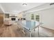Spacious game room features a fireplace, built-in shelving, hardwood floors and ping pong table at 327 Whitestone Rd, Charlotte, NC 28270