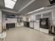 Functional laundry room with new washer, dryer, and ample storage space for detergents and supplies at 327 Whitestone Rd, Charlotte, NC 28270