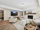 Inviting living room with cozy fireplace, built-in shelving, and plush seating for relaxing and entertaining at 327 Whitestone Rd, Charlotte, NC 28270
