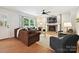 Comfortable living room with a fireplace, hardwood floors, and bright natural light at 327 Whitestone Rd, Charlotte, NC 28270