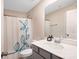Bathroom featuring a toilet, sink, and shower with a decorative curtain at 334 Kennerly Center Dr, Mooresville, NC 28115