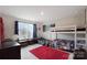 ' bedroom features a bunk bed, and a big window with blue curtains at 334 Kennerly Center Dr, Mooresville, NC 28115