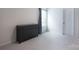 Bedroom with dark dresser in the corner next to a window with gray curtain at 334 Kennerly Center Dr, Mooresville, NC 28115