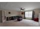 Spacious bonus room with a sofa, ceiling fan, large window, and plush carpeting at 334 Kennerly Center Dr, Mooresville, NC 28115