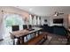 Cozy dining area featuring wood floors, natural light, and views of the backyard at 334 Kennerly Center Dr, Mooresville, NC 28115