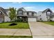 Beautiful two-story home with stone accents, lush lawn, and attached two car garage at 334 Kennerly Center Dr, Mooresville, NC 28115