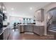 Modern kitchen with stainless steel appliances, granite countertops, and gray cabinetry at 334 Kennerly Center Dr, Mooresville, NC 28115