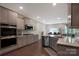 Well-equipped kitchen features stainless steel appliances, stone countertops, and sleek cabinetry at 334 Kennerly Center Dr, Mooresville, NC 28115