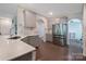 Bright kitchen featuring stainless steel appliances, stone countertops, and ample cabinet space at 334 Kennerly Center Dr, Mooresville, NC 28115