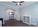 Bright living room featuring hardwood floors, arched doorways, and fresh paint at 334 Kennerly Center Dr, Mooresville, NC 28115