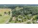 Expansive aerial view showcasing the property's large lot and mature trees in a serene, wooded neighborhood at 3980 English Oak Dr, Lincolnton, NC 28092