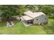 Aerial view of a home with a fire pit area, covered patio, and a spacious, well-maintained lawn at 3980 English Oak Dr, Lincolnton, NC 28092