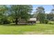 Inviting backyard featuring an outdoor seating area and a lush green lawn, perfect for relaxation at 3980 English Oak Dr, Lincolnton, NC 28092