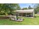 Spacious backyard with a fire pit area, a covered patio and ample space for outdoor activities at 3980 English Oak Dr, Lincolnton, NC 28092