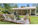 Cozy backyard featuring a fire pit surrounded by chairs, perfect for outdoor gatherings and relaxation at 3980 English Oak Dr, Lincolnton, NC 28092