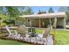 Outdoor area includes a fire pit and seating along with a covered patio for relaxing and entertaining at 3980 English Oak Dr, Lincolnton, NC 28092