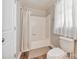 Clean bathroom featuring a shower/tub combination with a linen curtain and tiled floors at 3980 English Oak Dr, Lincolnton, NC 28092