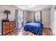 Comfortable bedroom is illuminated by natural light and features hardwood floors and a blue bed at 3980 English Oak Dr, Lincolnton, NC 28092