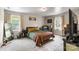 Cozy bedroom is filled with natural light and features a comfortable bed, chair, and desk at 3980 English Oak Dr, Lincolnton, NC 28092