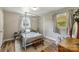 Serene bedroom with neutral walls, a canopy bed, and hardwood floors at 3980 English Oak Dr, Lincolnton, NC 28092