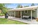 Relaxing covered patio with comfortable seating, a grill, and easy access to the backyard at 3980 English Oak Dr, Lincolnton, NC 28092