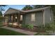 Charming home with a covered porch, lush landscaping, and inviting curb appeal at 3980 English Oak Dr, Lincolnton, NC 28092