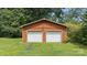 Two-car detached garage with white doors, offering ample parking and storage space on a grassy lot at 3980 English Oak Dr, Lincolnton, NC 28092